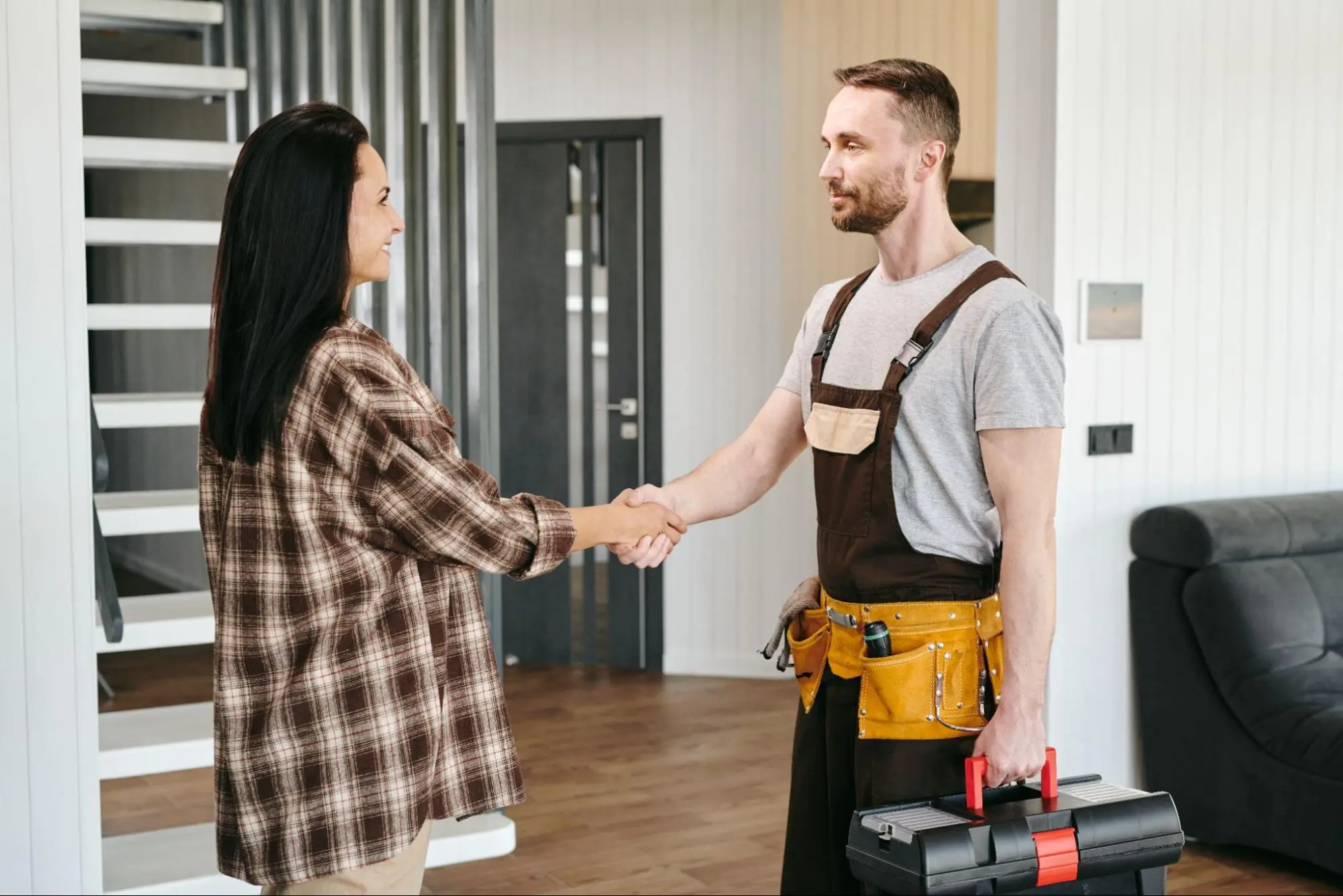 Handyman UAE greeting a homeowner with a handshake before starting home repair work