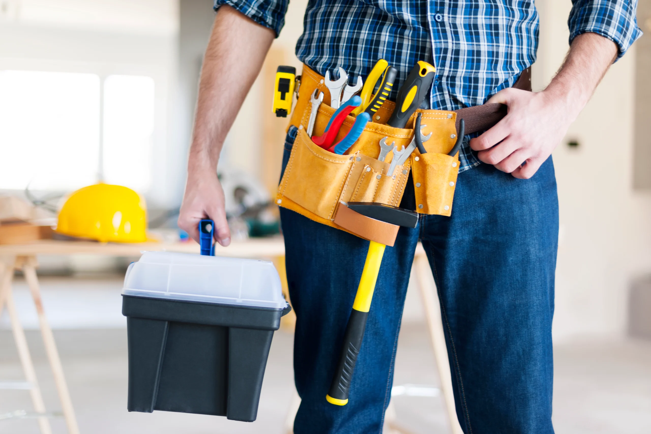 Types of Handyman Services: Man carrying toolbox